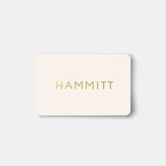 a white and gold business card with the word hammitt on it