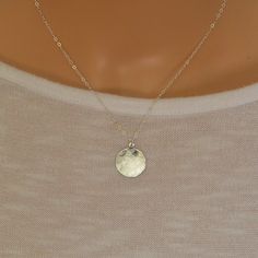 This beautiful simple sterling silver disc charm has been gently hammered to give it a beautiful sheen when the light hits it. It suspends from a sterling silver trace chain.  The disc charm measures 16 mm There is a choice of 14, 16, 18 or 20 inch sterling silver chain. A great everyday wear necklace  The necklace will arrive in a gift box so ready to give to a loved one. Wear Necklaces, Silver Circle, Teardrop Necklace, Moonstone Necklace, Necklace Sterling Silver, Star Necklace, Sterling Silver Chain, Northern Ireland, Gemstone Necklace