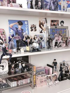 a shelf filled with anime figurines and action figures on top of it's shelves