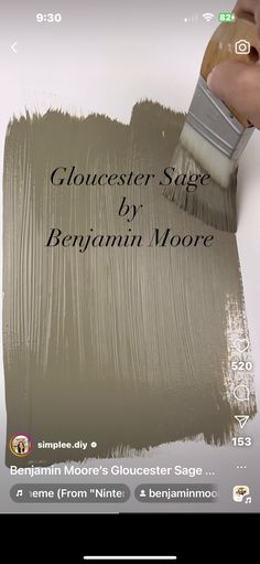 a person is using a paintbrush to paint a wall with the words gloucester sage by benjamin moore