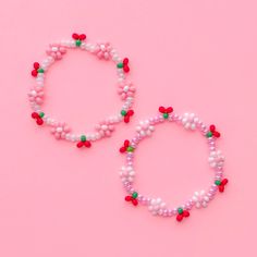 This listing is for 1 (one) cherries & daisies bracelet! This bracelet does not come with a letter bead bracelet or the single stacker cherry bracelet. The video is just to show what this bracelet looks like stacked with the others :) *Link to the single cherries bracelet: https://www.etsy.com/listing/1762278403/ *Link to the custom name bracelet: https://www.etsy.com/listing/940495777/ SIZING: Measure your wrist around the widest point and add .25-.5 inches to get the most comfortable or desired fit. If you don't have a flexible tape measure, you can use a piece of string to wrap around your wrist and then measure the length of the string. (For example: my wrist size is 6" and I will wear a 6.5" bracelet for a snug fit and 7" for a loose fit). CARE INSTRUCTIONS: Please be careful to not o Cute Flower Stretch Bracelet For Gift, Spring Friendship Bracelets With Letter Beads As Gifts, Spring Gift Friendship Bracelets With Letter Beads, Spring Festival Gift Bracelets With Round Beads, Spring Gift Bracelets With Round Beads, Cute Flower Shaped Beaded Bracelets For Gift, Sweet Adjustable Beaded Bracelets With Round Beads, Red Bracelet Gift For Spring, Adjustable Sweet Style Beaded Bracelets With Round Beads