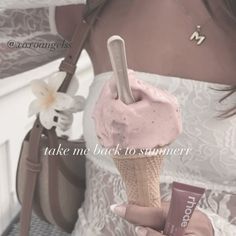 a woman holding an ice cream cone with pink frosting on it and the words take me back to summer