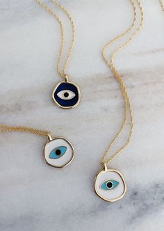 Ready to ship. Sustainably Sourced Materials. Our evil eye necklace is made by hand with enamel, Hangs from a 16” double chain 14k gold plated. Available in 2 colors. Evil Eye Hand, Eye Pendant Necklace, Hand Necklace, Blue Evil Eye, Minimal Jewelry, Eye Pendant, Evil Eye Pendant, Double Chain, Jewelry Photography