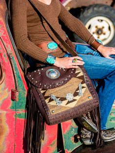 On our last trip to Santa Fe I found the most amazing bags. We hit it off and away we went. I met with her at her studio on our way out of town and went over our favorite designs. Native made and inspired, using 1920's vintage rugs, deer skin and vintage sterling silver, our South by Southwest bags are the finest Navajo rug bags on the market. These will start rolling in soon, each bag one of a kind! This large messenger style bag boast 30 sterling conchos, Two sterling arrows, a beautiful stamp Bohemian Hand Tooled Satchel For Travel, Southwestern Hand Tooled Bags For Everyday Use, Unique Brown Travel Bags, Brown Southwestern Style Shoulder Bag For Everyday Use, Brown Southwestern Rectangular Shoulder Bag, Southwestern Brown Rectangular Shoulder Bag, Southwestern Style Brown Rectangular Shoulder Bag, Navajo Rug, South By Southwest