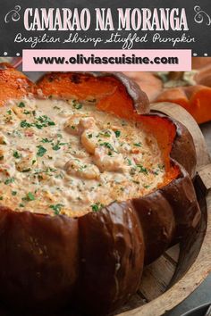 a close up of a bowl of food in a pumpkin shaped dish on a table