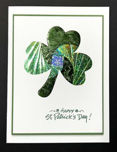 a st patrick's day card with four leaf clovers