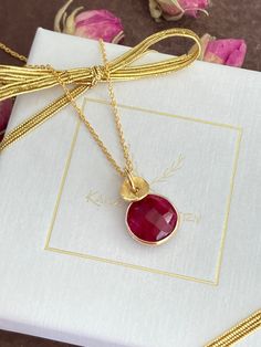 "Beautiful 24k gold vermeil necklace featuring a natural Ruby. The pendant hangs on a 24k gold vermeil chain. Vermeil is a thick coat of 24 karat gold on solid sterling silver. Ruby is the the birthstone for July. Rubies are often associated with wealth, prosperity, love and passion. This gorgeous necklace will make a perfect gift for any occasion. Pendant length: 1.8 cm ( 0.7\") Pendant width: 1.1 cm (0.4\") Ruby: 1 cm (0.3\") in diameter. The necklace will come in a beautiful gift box. * CHECK Gold Faceted Birthstone Necklace Fine Jewelry, Faceted Pendant Necklace For Gift, Gold Faceted Birthstone Necklace, Gold Charm Necklace With Gemstone For Her, Gold Gemstone Charm Necklace For Her, Gold Gemstone Charm Necklace As Gift For Her, Gold Faceted Round Necklace, Gold Faceted Pendant Necklace, Gold Faceted Fine Jewelry Necklace