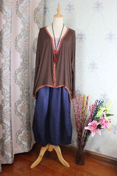 "【Fabric】 cotton 【Color】 dark brown 【Size】 Shoulder width is not limited Shoulder + sleeve length 72cm/ 28 \" Bust 160cm/ 62 \" Length 57-80cm/ 22-31 \" Washing & Care instructions: -Hand wash or gently machine washable do not tumble dry -Gentle wash cycle (40oC) -If you feel like ironing (although should not be necessary) , do it with steam or while the dress is still slightly wet -Do not bleach If you like this dress, perhaps you will also like other dresses from our collection. Be sure to Dark Brown Blouse, Oversize Blouse, Bat Shirt, Knitted Shirt, Purple Maxi Dress, Linen Fashion, Plus Size Clothes, Oversized Blouse, Super Cute Dresses