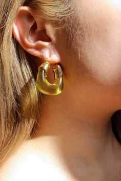 PRODUCT DESCRIPTION If you are a fan of Complete. Studio. You would know Amber Hoop Earrings are our all-time best sellers. Same style, but a burst of vibrancy and zest has been landed for your accessory collection. These eye-catching hoops feature a delightful lemon hue that exudes freshness and energy. Statement Hoop Earrings Water Resistant 18k Gold-plated on High-quality brass Handcrafted Resin Pieces 3.6cm in height 3.2cm in width Weight: 12-14g for each Read our full Jewellery Care Guide h Retro Yellow Earrings For Party, Yellow Retro Party Earrings, Retro Yellow Party Earrings, Gold Retro Summer Earrings, Modern Yellow Earrings For Everyday, Modern Yellow Earrings For Everyday Wear, Vintage Yellow Earrings For Summer, Trendy Yellow Earrings, Vintage Yellow Summer Earrings