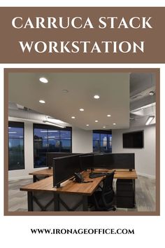 an office with two desks and three monitors