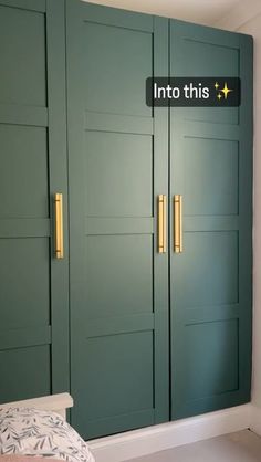 an image of a bedroom with green closets and gold handles on the door knobs