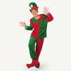 a man in a green and red elf costume standing with his hands out to the side