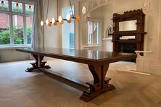 a large wooden table sitting in the middle of a room