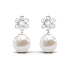 Product Details The drop earring pair combines the shimmer of Diamond and the timeless elegance of pearl to create this effortlessly classic piece. Featuring a bead set round pearl and bezel set round Diamond, that form a delicate floral motif above the white gemstone, the screw back earrings have an unmatched beauty that is sure to turn heads. Wear them as an everyday companion or to add a bit of shine to your looks. Product Information SKU SHP-EARRINGS0621114605 Length 21 mm Width 10 mm Height Freshwater Pearl Drop Earrings, Bezel Set Diamond, Diamond Flower, Screw Back Earrings, Pearl Drop, Pearl Drop Earrings, Bezel Setting, Shop Earrings, Fresh Water