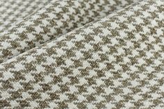 the fabric is made up of brown and white houndskind tweed, which are very soft