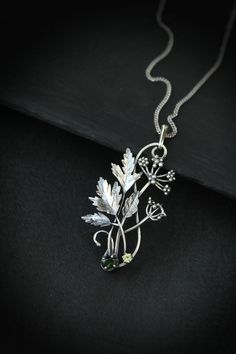 ITEM DESCRIPTION: The size H 5 cm x W 3 cm (2 x 1 1/3 inch). Weight - 5 g. You can buy it with a silver chain or without it. Even simple plants look very elegant. I made one of sterling silver, pretty green tourmaline, and peridot. This unique botanical jewelry looks like a real treasure of wild forest. It is really worthy of being in your precious collection. Expect many compliments on this! This handmade necklace will come to you in a gift box - ready for gifting. The parcel will be sent durin Delicate Green Sterling Silver Necklace, Delicate Green Sterling Silver Necklaces, Green Sterling Silver Flower Pendant Jewelry, Botanical Sterling Silver Jewelry Gift, Green Sterling Silver Necklace With Flower Pendant, Nature-inspired Silver Metal Necklace, Nature-inspired Sterling Silver Leaf Necklace, Nature-inspired Leaf Shaped Sterling Silver Necklace, Silver Nature-inspired Metal Jewelry