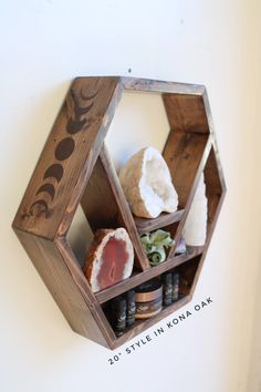 a wooden hexagonal shelf with various items in it