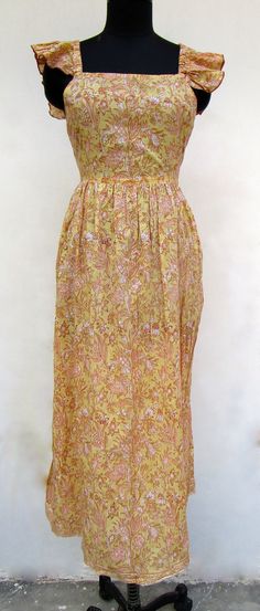 "ITEM DESCRIPTION light yellow printed maxi dress - square neckline with back strap maxi dress - short sleeve boho maxi dress Features: short sleeve, square neck, Long dress Material: Cotton cambric Fabric: 100% cotton soft light weight ethnic print fabrics  Sleeve Length = 5 inch For more sizes & their measurement, please refer our below chart to understand the sizes variations available with us For your size requirement, please mention your size in seller note at the time of buying. SIZE MEASU Square Neck Long Dress, Strap Maxi Dress, Short Sleeve Maxi Dresses, Ethnic Print, Dress Short Sleeve, Yellow Print, Boho Maxi, Women Maxi, Boho Maxi Dress