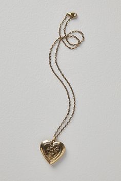 A super sweet gift or an accessory unique to you, this darling monogram necklace features a heart locket pendant with an initial engraving. **Features:** Dainty chain, heart locket pendant, hinge opening mechanism, monogram initial engraving, clasp closure **Why We | Monogram Necklace by Free People in Gold Meaningful Pictures, Chain Heart, Sweet Necklace, Dainty Chain, Monogram Necklace, Sweet Gifts, Heart Locket, Monogram Initials, Super Sweet