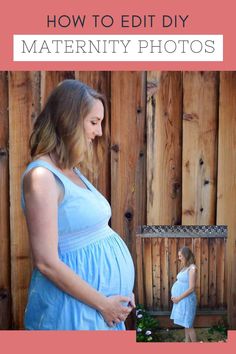 a pregnant woman standing in front of a wooden fence