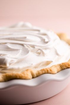 a white pie with whipped cream on top