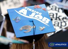 a blue graduation cap with sea animals on it