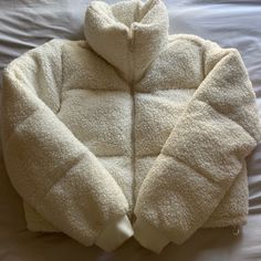 Size Large Subtle Off-White Colored (Can Provide More Photos If Necessary) Never Worn - Just Too Big For Me Abercrombie Puffer Jacket, Hollister Puffer Jacket, Abercrombie Faux Fur Mini Puffer, White Sherpa Outerwear With Pockets, Hollister Jacket, Hollister Jackets, Beige Jacket, Cream White, Hollister