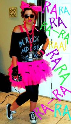 a woman in a pink tutu skirt and black shirt