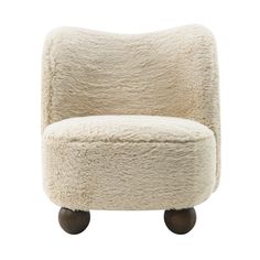 a white chair with wheels on it and sheepskin upholstered in the back