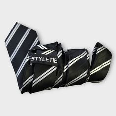 Treat yourself with a new pattern and splash of color to your look with this unique tie set. 100% Silk Handmade Package Includes: Tie, Pocket Square & Cufflinks. Length: 59" Width: 3.34" Warm iron if needed Silver Ties For Black Tie Occasions, Adjustable Silver Ties For Black Tie Events, Adjustable Silver Suit And Tie Accessories For Black Tie, Silver Adjustable Accessories For Black Tie Suit, Silver Adjustable Tie For Business, Silver Adjustable Suit And Tie Accessories For Gift, Father's Day Silver Suit And Tie Accessories, Classic Silver Tie, Adjustable Black Tie For Office