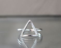 I handcraft each triangle ring out of tarnish resistant Argentium sterling silver square wire. I give it high polish for a clean modern look. It's strong and sturdy for everyday wear and care. Each ring is made to order just for you! P R O D U C T I O N ~ T I M E : Depending on my current amount of orders, it usually takes me 1-2 weeks to craft your item. Message me if you need a rush order! Send questions my way anytime! Peace & Gratitude, ♥Ali Rae Additional ~ D E T A I L S What is Argenti Geometric Silver Ring As Gift, Silver Geometric Rings As Gifts, Silver Geometric Ring As Gift, Silver Geometric Ring Gift, Silver Geometric Ring For Gift, Modern Hypoallergenic Sterling Silver Midi Rings, Modern Nickel-free Sterling Silver Midi Rings, Adjustable Geometric Rings For Gifts, Adjustable Geometric Rings As Gift