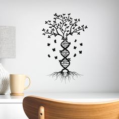 a wall decal with a tree and butterflies in the form of a spiral staircase