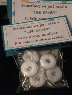 a bag of white doughnuts sitting in front of a sign that says sometimes we just need to help save a life saver