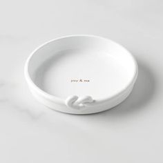 a white bowl with the words you & me written on it