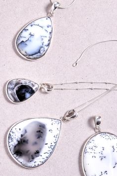 The Dendrite Opal stone makes each pieces of jewellery like no other. The pendant is made with 925 sterling silver. Dimensions: Total height: 62mm Total width: 39mm Stone height: 45mm Stone width: 36mm Bezel + stone thickness: 5mm Bail size: 7mm - Please note - * Chains are available on request * Only the pendant from the second photo and without the chain is included in the price. * Gemstones are natural material, they can slightly differ in color, size, shape and may show some inclusions or cracks inside the stone itself. We do take great care in picking the best quality stones for best quality jewellery. Sterling Silver Teardrop Stones Jewelry, Sterling Silver Teardrop Jewelry, Silver Teardrop Gemstones, Teardrop Silver Gemstones For Jewelry Making, Silver Pear-shaped Natural Stone Jewelry, Silver Teardrop Natural Gemstones, Sterling Silver Drop Jewelry With Natural Inclusions, Teardrop Agate Jewelry With Large Stone, Dendrite Opal