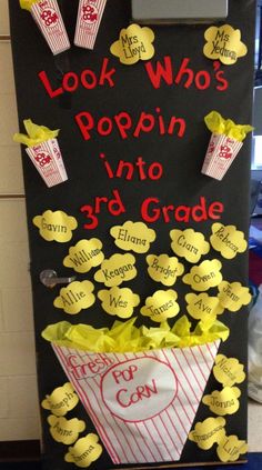 a classroom door decorated with popcorn and cutouts for the 3rd grade students to use