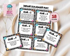 four editable posters for indoor scavenger hunt on a plate with flowers in the background