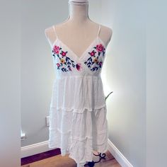 Summer Dress By Francesca Sz L White Linen With Embroidered Flowers. Never Worn Summer Vacation Embroidered Midi Dress, Embroidered Midi Dress For Summer Vacation, Spring Beach Embroidered Midi Dress, Spring Beach Midi Dress Embroidered, Casual Beach Midi Dress With Floral Embroidery, Casual Floral Embroidery Midi Dress For Beach, Sleeveless Floral Embroidery Mini Dress For Daywear, Sleeveless Mini Dress With Floral Embroidery For Daywear, Sleeveless Floral Embroidery Day Dress