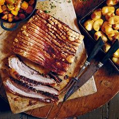 sliced meat and potatoes on a cutting board