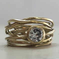 14k Gold Rings With Tension Setting And Modern Twist, Modern Round Rings In Recycled Gold, Modern Yellow Gold Diamond Ring With Tension Setting, Modern 14k Gold Tension Setting Ring, 14k Gold Rings With Tension Setting, Unique Gold Engagement Rings, Gold Twist Ring, Gold Wrap Ring, Gold Wrap