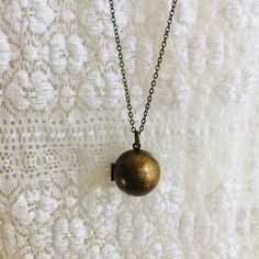 "Vintage brass ball locket. Measures 3/4\" round. Made in the 1970's it has beautiful patina. Opens and shuts tightly. It can hold two teeny, tiny, pictures. 1/2\" or smaller. Perfect necklace for layering. You may choose the length of your choice in the drop down menu above. Last photo shows the same locket available in a dark brass: https://www.etsy.com/listing/693755952/hidden-locket-necklace-bee-secret?ref=shop_home_active_8&pro=1&frs=1 I offer quick shipping and all packages will ar Secret Compartment Necklace, Etsy Coupon Codes, Unique Locket, Bee Wings, Handwritten Gifts, Locket Design, Sweet Necklace, Jewelry Safe, Bird Necklace