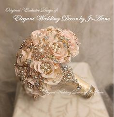 a bridal bouquet on top of a white box with pearls and brooches