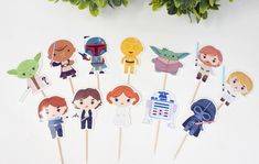 star wars cupcake toppers on sticks with stickers in the shape of characters