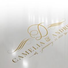 a white and gold logo with the words camellia & ampel on it's side