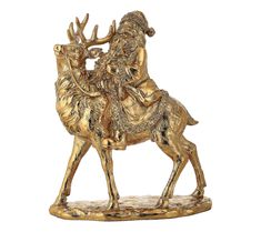 a golden statue of a man riding on the back of a deer