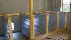 the inside of a storage room with metal walls and flooring in place for insulation