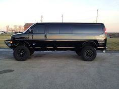 a black van parked in a parking lot