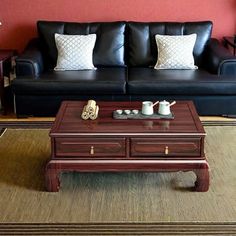 a living room with two couches and a coffee table in front of the couch