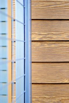 the side of a house with wood siding