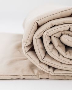 an unmade blanket folded on top of each other